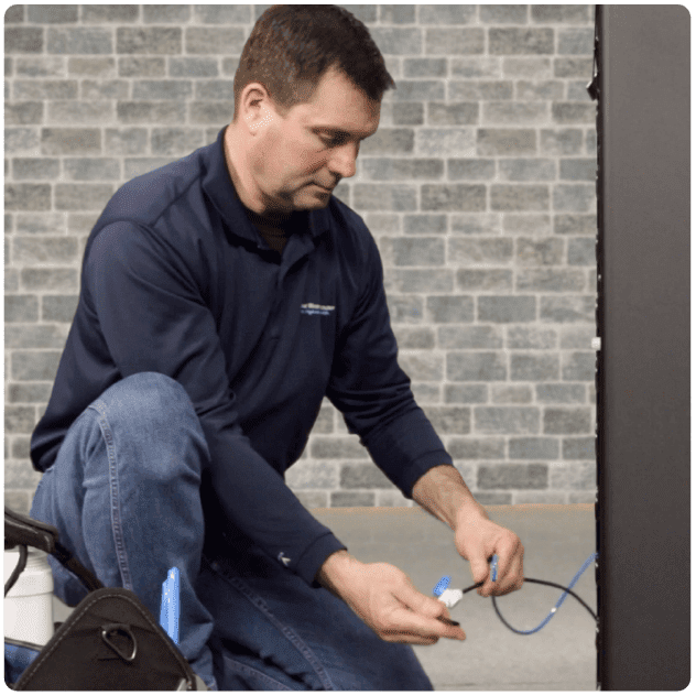 Hydrate HQ White Glove Service A man holding wires