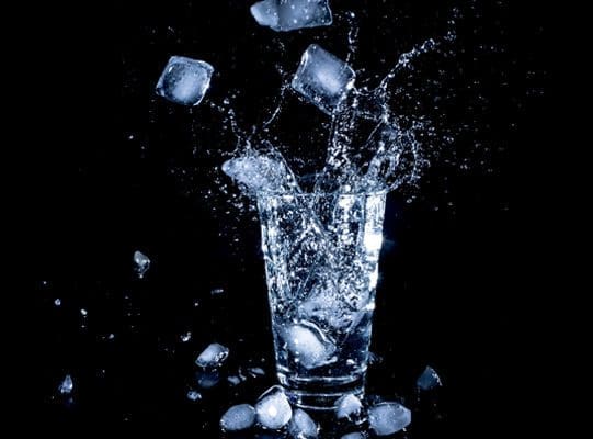 glass of ice water splashing glass of ice water splashing
